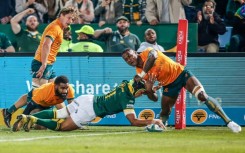 South Africa wing Kurt-Lee Arendse (C) scores a try against Australia in a Rugby Championship match in Pretoria on July 8, 2023.