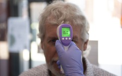 Fever screening is increasingly being set up as a requirement before entry is allowed into hospitals, shops, workplaces and schools.