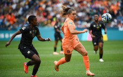 Netherlands' forward #11 Lieke Martens (R) and South Africa's defender #14 Tiisetso Makhubela vie for the ball during the Australia and New Zealand 2023 Women's World Cup round of 16 football match between Netherlands and South Africa at Sydney Football Stadium in Sydney on August 6, 2023. (Photo by FRANCK FIFE / AFP)