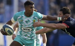 Canan Moodie (L) runs through a tackle by Argentina's Los Pumas Juan Martin Gonzalez Samso during the Rugby Union test match. AFP/JUAN MABROMATA