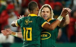 Celebrate: South Africa fly-half Manie Libbok (left) celebrates with scrum-half Faf de Klerk 