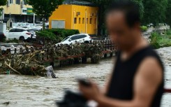 At least 11 people are known dead after heavy rains wreaked havoc in Beijing, state media has said