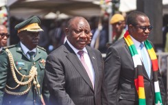 South African President Cyril Ramaphosa (C) arrives for Zimbabwean President Emmerson Mnangagwa's (unseen) inauguration ceremony in Harare on September 4, 2023. (Photo by Zinyange Auntony / AFP)