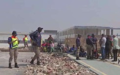 JMPD officers at the site of a hijacked building.