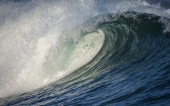 File: An Atlantic Ocean wave breaking, spray flying on the Hermanus shore. Roger de La Harpe/Biosphoto via AFP