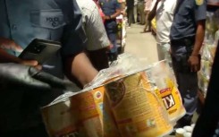 Police found some expired goods, including milk powder. eNCA