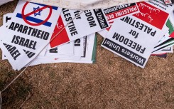 Placards are seen on the ground after a pro-Palestinian demonstration in Lenasia. AFP/Emmanuel Croset