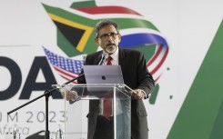 Minister of Trade and Industry of South Africa Ebrahim Patel (R) speaks on the first day of the 20th African Growth and Opportunity Act (AGOA) summit in Johannesburg on November 2, 2023.