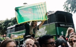 A springbok supporter hold up a flag during the Springboks Champions trophy tour in Durban, on November 4, 2023, after South Africa won the France 2023 Rugby World Cup final match against New Zealand. (Photo by RAJESH JANTILAL / AFP)