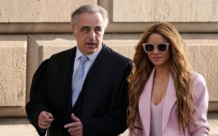 Colombian singer Shakira arrives with her lawyer Pau Molins (L) at the High Court of Justice of Catalonia for her trial on tax fraud. AFP/Pau Barrena