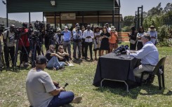 Rob Matthews (R), spokesperson for June Steenkamp, Reeva Steenkamp's mother, speaks to the media at the Atteridgeville Correctional Centre. AFP/Roberta Ciuccio