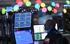 Traders work on the floor of the New York Stock Exchange (NYSE). AFP/Angela Weiss