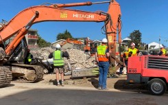 Excavators at the site of the George building collapse.