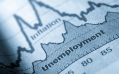 A folded sheet of paper with an unemployment graph on. Getty Images/JL Gutierrez