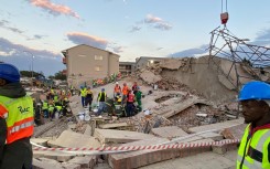 Workers busy at the George Building Collapse