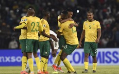 Bafana Bafana players celebrate their victory over Zimbabwe. BackpagePix/Sydney Mahlangu