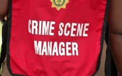 File: A police officer at a crime scene. eNCA