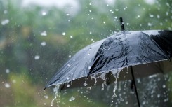 File: A person holding an umbrella in the rain. GettyImages/sarayut Thaneerat