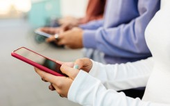 File: Teenagers using cellphones. GettyImages/Xavier Lorenzo