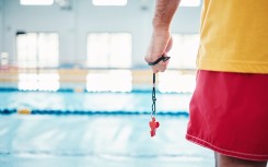 File: A lifeguard at a swimming pool. GettyImages/PeopleImages