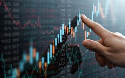 File: Candlestick chart and data of financial market. GettyImages/tadamichi