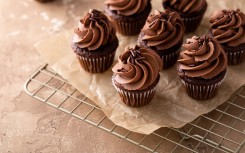 File: Dark chocolate cupcakes with chocolate ganache frosting. GettyImages/VeselovaElena