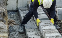 File: A bricklayer on a construction site. GettyImages/Iryna Melnyk