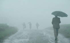 File: People walking in the rain. David Turnley/Corbis/VCG via Getty Images