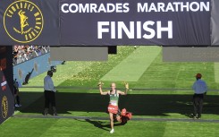 Piet Wiersma crosses the finish line of the 2024 Comrades Marathon. BackpagePix/Phakamisa Lensman