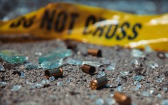 File: Bullet casings and broken glass at a crime scene. GettyImages/D-Keine