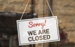 File: A closed sign in a shop window. Peter Titmuss/UCG via Getty Images