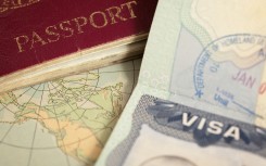 File: A passport and visa. GettyImages/belterz