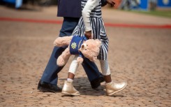 File: A little girl seen at the annual SAPS Commemoration Day at the SAPS Memorial Site at the Union Buildings. Alet Pretorius/Gallo Images via Getty Images