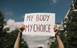 File: Woman holding a sign "My Body, My Choice. GettyImages/Amparo Garcia