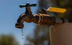 File: Water dripping from a tap. GettyImages/Bloomberg Creative