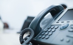 File: A telephone seen on a desk. GettyImages/Chainarong Prasertthai