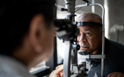 File: An ophthalmologist examining a patient's eyes. GettyImages/FG Trade