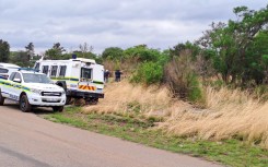 Police officers waiting for the illegal miners to resurface. eNCA/Bafedile Moerane