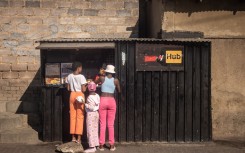 Girls shop at a tuck shop in Alexandra. Chris McGrath/Getty Images