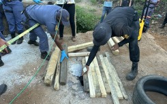 Police officers at an abandoned mine in Sabie. eNCA/Pule Letshwiti-Jones