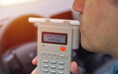 File: A driver taking a breathalyser test for alcohol. GettyImages/Daniel Chetroni