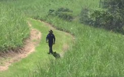 Police officers search for a toddler's body in Othongathi, KZN