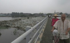 Beijing park engulfed in floodwater and plastic waste