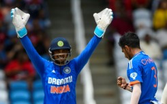 That's out: Yuzvendra Chahal (right) and Ishan Kishan celebrate the dismissal of Brandon King