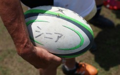 The word 'senior' is inscribed in Japanese on a ball used at an Over-70s training session in Kamakura