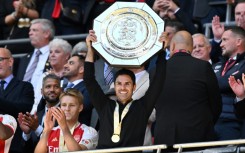 Arsenal manager Mikel Arteta lifts the Community Shield trophy