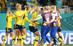 Sweden players celebrate after beating Japan at Eden Park to set up a semi-final against Spain