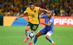 Sam Kerr holds off French defender Maelle Lakrar after coming on as a second-half substitute