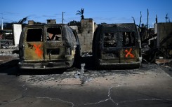 Spray-painted Xs marked vehicles that lay in the street -- a sign to firefighters they have been checked for victims