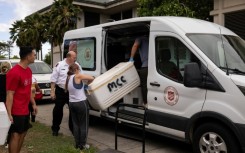 Members of the Salvation Army and other volunteer networks pick up the food, which arrives at shelters and in Lahaina still warm